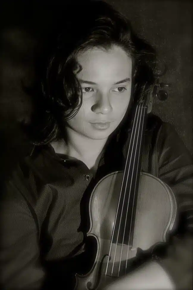 autism aspergers story inspiring kid holding violin